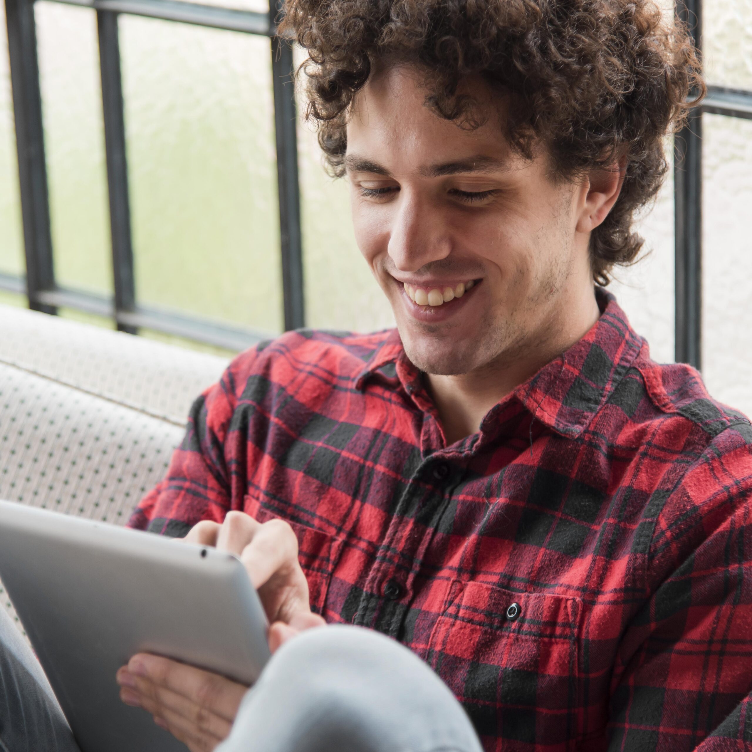 Man using tablet for online English speaking practice